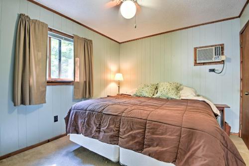 a bedroom with a large bed in a room at Peaceful Hamlin Home with Lake Access at The Hideout in Hamlin