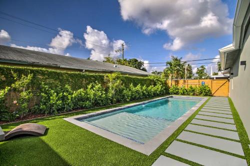 a swimming pool in the backyard of a house at Modern Home with Shared Pool in Fort Lauderdale! in Fort Lauderdale