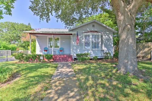 a white house with a tree in the yard at Vintage Corpus Christi Home - 2 Blocks From Beach! in Corpus Christi