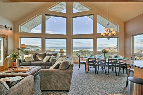 a large living room with a table and a couch at Logan Road Lookout, Lincoln City Home with Game Room in Lincoln City