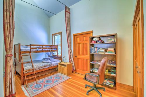 a bedroom with a bunk bed and a desk and a chair at Shelburne Studio Cabin with Spring-Fed Pool! in Shelburne