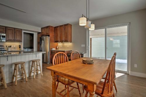 a kitchen and dining room with a wooden table and chairs at 30 Mi to Crested Butte Dog-Friendly Home By River in Gunnison
