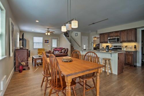 a kitchen and living room with a wooden table and chairs at 30 Mi to Crested Butte Dog-Friendly Home By River in Gunnison