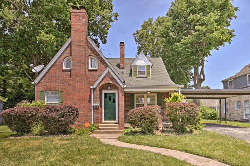 a brick house with a green door at Indianapolis Vacation Rental - Walk to the IMS! in Indianapolis
