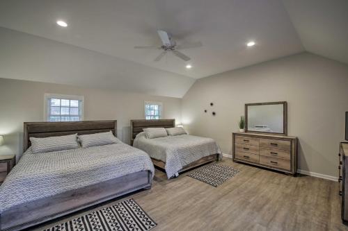 a bedroom with two beds and a ceiling fan at Indianapolis Vacation Rental - Walk to the IMS! in Indianapolis
