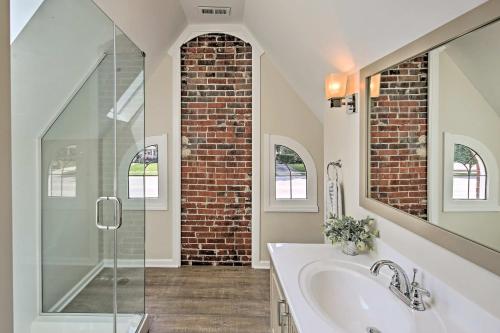 a bathroom with a sink and a glass shower at Indianapolis Vacation Rental - Walk to the IMS! in Indianapolis