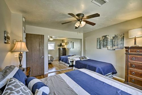 a bedroom with two beds and a ceiling fan at Flagstaff Townhome - Walk to Country Club and Pools! in Flagstaff