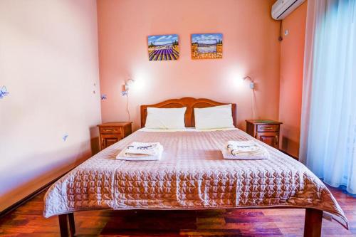a bedroom with a bed with two towels on it at 500 Meters from Grate Beach, App 9 in Ulcinj