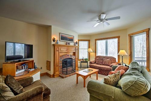 a living room with two couches and a fireplace at Inviting Ski-inandSki-out Condo at Jay Peak Resort! in Jay