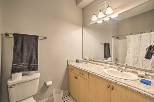 a bathroom with a sink and a toilet and a mirror at Heart of the Brooklyn Arts District Urban Gem! in Wilmington