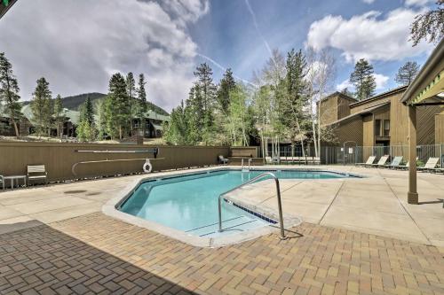 a swimming pool in a yard with a house at Ski Shuttle and Mountain Views Keystone Resort Home in Keystone