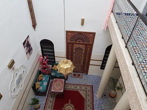 an overhead view of a stairway with a room with a door at Dar Atlantic in Fès