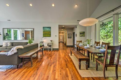a living room with a couch and a table at Luxury Lodge on 45 Acres Patio, Deck and Views! in Fairview