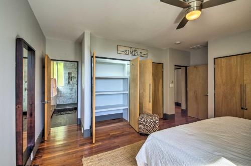 a bedroom with a bed and a ceiling fan at Luxury Lodge on 45 Acres Patio, Deck and Views! in Fairview