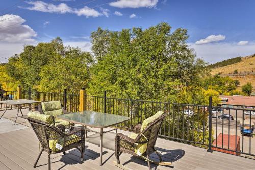 a patio with a table and chairs on a deck at Lava Hot Springs Studio - Walk to Portneuf River! in Lava Hot Springs