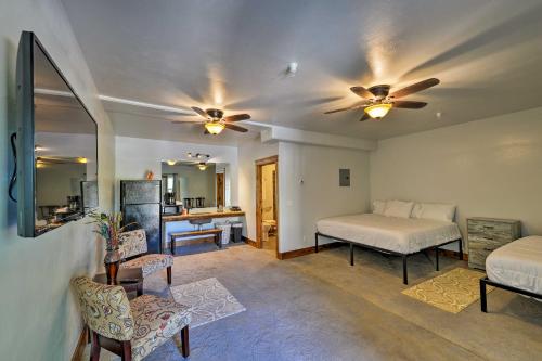 a living room with two beds and a kitchen at Lava Hot Springs Studio - Walk to Portneuf River! in Lava Hot Springs