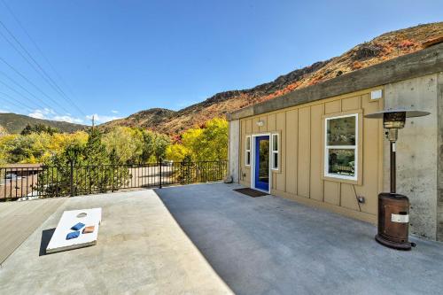 a building with a door and a patio at Lava Hot Springs Studio - Walk to Portneuf River! in Lava Hot Springs