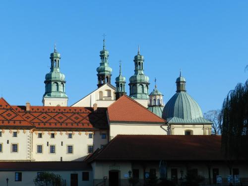 a large building with domes on top of it at Dom Pielgrzyma in Kalwaria Zebrzydowska