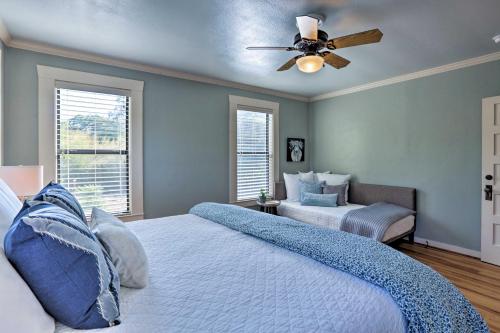 a bedroom with a bed and a ceiling fan at Fredericksburg Cottage with Grill - Walk to Main St! in Fredericksburg