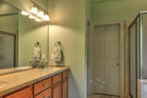 a bathroom with a sink and a mirror at Midway House by Sunbury Channel - Walk to Marina! in Fancy Hall