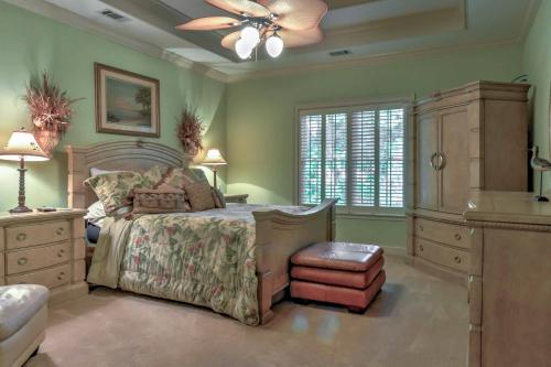a bedroom with a bed and a ceiling fan at Midway House by Sunbury Channel - Walk to Marina! in Fancy Hall