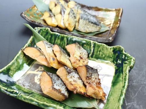 a green plate with food on top at APA Hotel Saga Ekimae Chuo in Saga