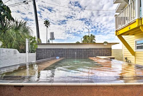 a swimming pool in the backyard of a house at Driftwood Beach Suite - Walk to Clearwater Bch in Clearwater Beach