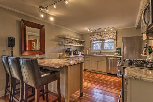 a large kitchen with a counter and a sink at Cozy Litchfield House with Fenced-In Yard and Fire Pit in Litchfield