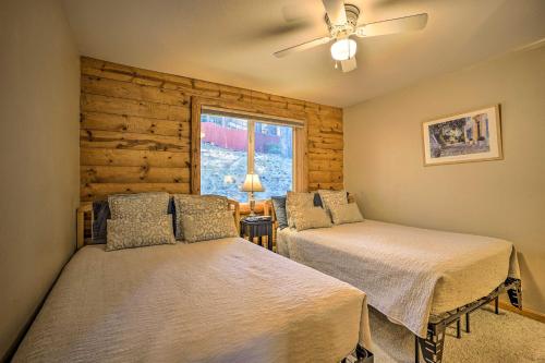 a bedroom with two beds and a window at Home with Indoor Pool in South Lake Tahoe! in South Lake Tahoe