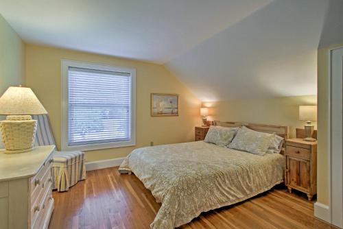 a bedroom with a bed and a window at half Mi to Beach Lovely Guesthouse in Kennebunk! in Kennebunk