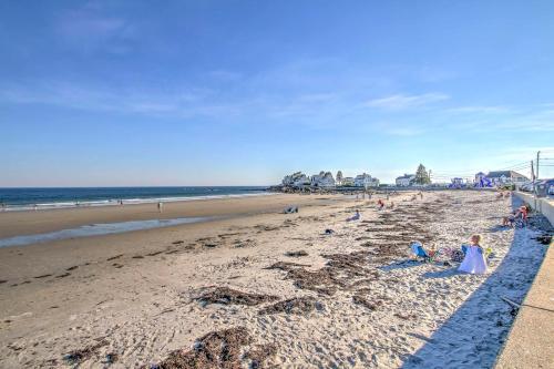 a group of people sitting on the beach at half Mi to Beach Lovely Guesthouse in Kennebunk! in Kennebunk