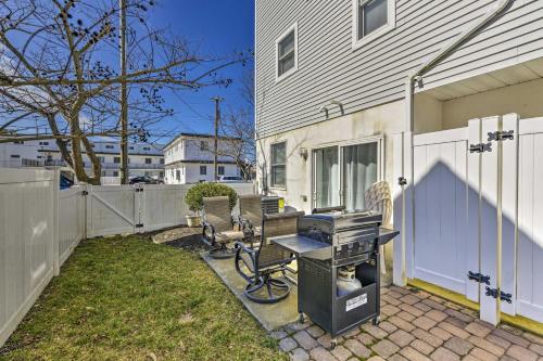 a bbq grill in the backyard of a house at Wildwood Townhome with Patio 1 Block To The Beach! in Wildwood