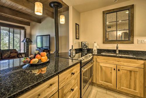 a kitchen with a bowl of fruit on a counter at Adobe-Style Abode with Amenities - Walk to Plaza! in Santa Fe