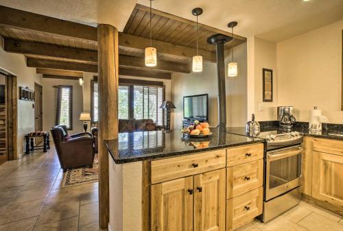 a kitchen with a large island in a room at Walkable Adobe-Style Abode with Community Amenities! in Santa Fe
