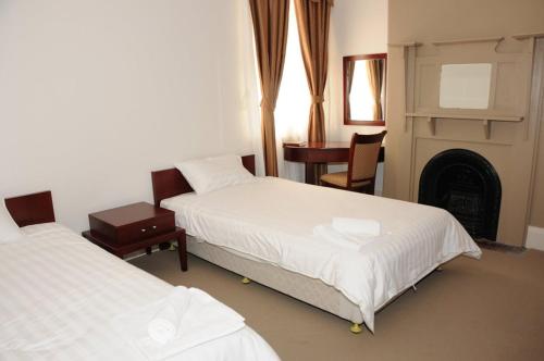 מיטה או מיטות בחדר ב-Railway Bistro - Kandos