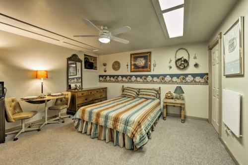 a bedroom with a bed and a desk and a table at Dolores Home on 19 Acres with Scenic Mountain Views! in Dolores
