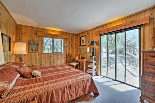 a bedroom with a bed and a large window at Dolores Home on 19 Acres with Scenic Mountain Views! in Dolores