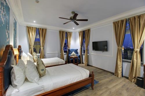 a bedroom with a bed and a ceiling fan at Jhadol Vijay Vilas Near Lake Pichola in Udaipur