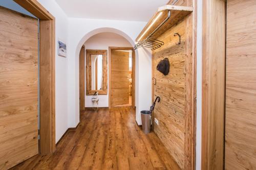 a hallway of a house with wooden walls at Ferienwohnungen Anger in Oberstdorf