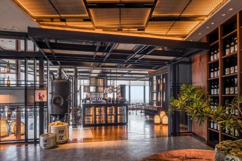a wine tasting room with a bar in a building at Rosewood Phnom Penh in Phnom Penh