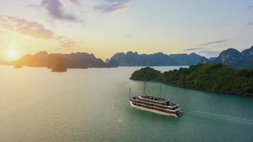 a boat floating on a large body of water at Dora Cruise by HAG in Ha Long