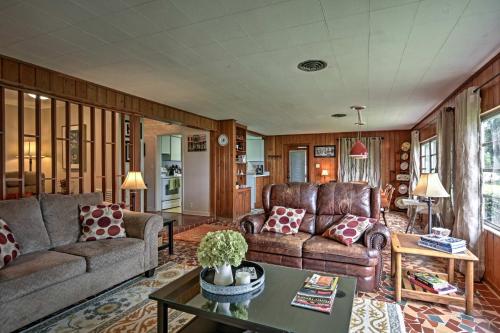 a living room with two couches and a table at Historic Lakefront Gem about 6 Mi to Bok Tower Gardens in Lake Wales