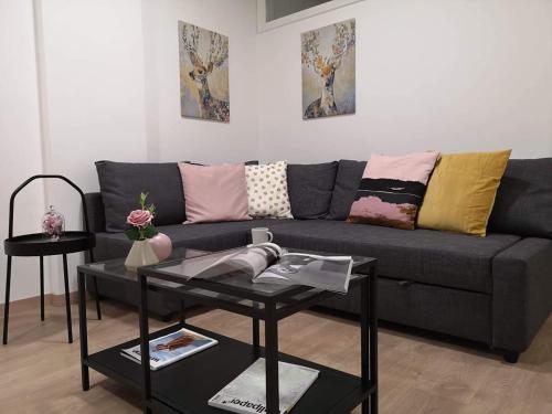 a living room with a couch and a table at Nemesis in Larnaka