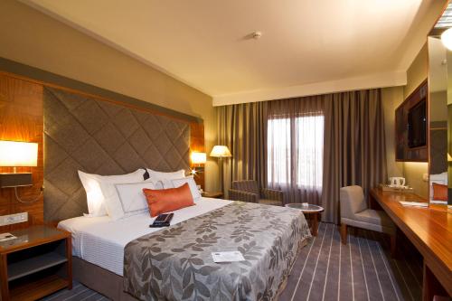 Cama o camas de una habitación en Tugcan Hotel