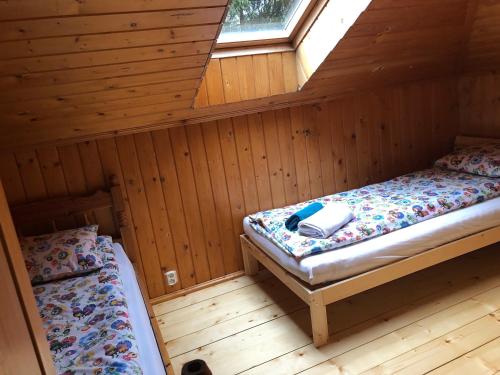 Postel nebo postele na pokoji v ubytování Domek Malinka 13