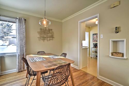 a dining room with a wooden table and chairs at Walk to Dtwn Bozeman Townhome with Fast WiFi in Bozeman