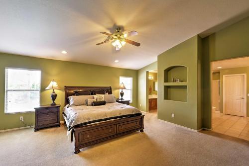 a bedroom with a bed and a ceiling fan at Spacious Litchfield Park Home with Yard, Heated Pool in Litchfield Park