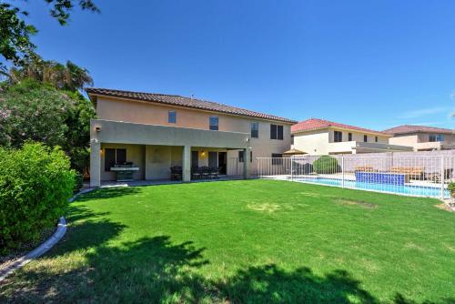 a large yard in front of a house at Spacious Litchfield Park Home with Yard, Heated Pool in Litchfield Park