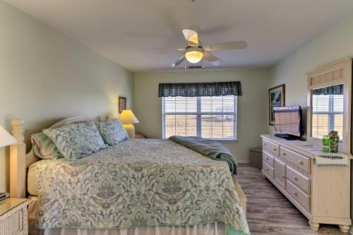 a bedroom with a bed and a ceiling fan at Ocean View Condo by Bethany Beach with Balcony! in Ocean View