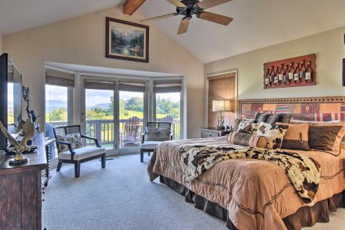 a bedroom with a large bed and a balcony at High Gravity Banner Elk Custom Chalet with Views! in Banner Elk